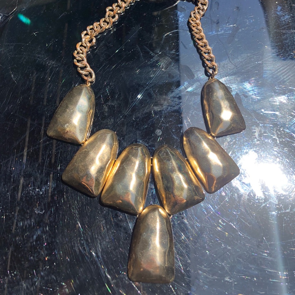 Chunky gold costume necklace.